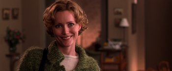 Movie still from “The Cable Guy” (1996), directed by Ben Stiller – A person wearing a sweater; Close Up shot, Over the shoulder angle