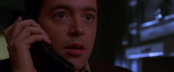 Movie still from “The Cable Guy” (1996), directed by Ben Stiller – A person talking on a cell phone; Close Up shot, Low angle