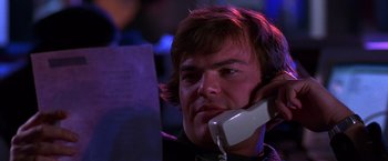 Movie still from “The Cable Guy” (1996), directed by Ben Stiller – A man on the phone in a dark room; Close Up shot, Low angle