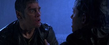 Movie still from “The Cable Guy” (1996), directed by Ben Stiller – A man and a woman in the rain talking to each other; Close Up shot, Over the shoulder angle
