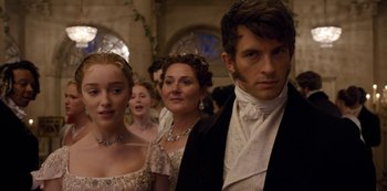 Movie still from “Bridgerton” (2020), created by Chris Van Dusen – A group of people in formal wear standing in a line; Close Up shot, Over the shoulder angle