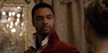 Movie still from “Bridgerton” (2020), created by Chris Van Dusen – A person wearing a red jacket; Close Up shot, Over the shoulder angle