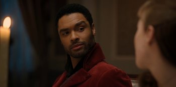 Movie still from “Bridgerton” (2020), created by Chris Van Dusen – A person wearing a red jacket; Close Up shot, Over the shoulder angle
