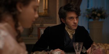 Movie still from “Bridgerton” (2020), created by Chris Van Dusen – A man sitting at a dinner table looking at a woman; Close Up shot, Over the shoulder angle