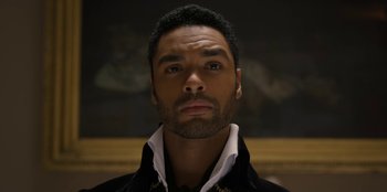 Movie still from “Bridgerton” (2020), created by Chris Van Dusen – A person with a beard; Close Up shot, Overhead angle