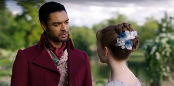 Movie still from “Bridgerton” (2020), created by Chris Van Dusen – A man and a woman are standing together; Close Up shot, Over the shoulder angle