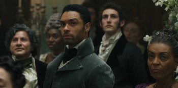 Movie still from “Bridgerton” (2020), created by Chris Van Dusen – A group of men standing next to each other; Close Up shot, Over the shoulder angle