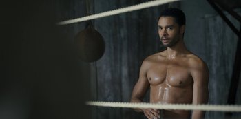 Movie still from “Bridgerton” (2020), created by Chris Van Dusen – A man standing in a boxing ring; Medium shot, Overhead angle