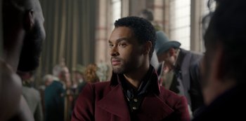 Movie still from “Bridgerton” (2020), created by Chris Van Dusen – A man wearing a red jacket; Close Up shot, Over the shoulder angle