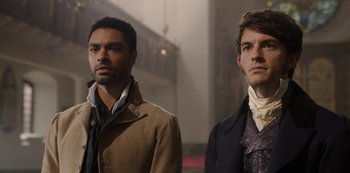 Movie still from “Bridgerton” (2020), created by Chris Van Dusen – Two men standing next to each other in front of a building; Close Up shot, Low angle