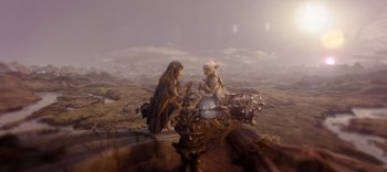 Movie still from “The Dark Crystal: Age of Resistance” (2019), created by Jim Henson – A woman sitting on top of a motorcycle next to a teddy bear; Wide shot, High angle