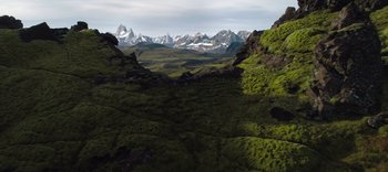 Movie still from “The Dark Crystal: Age of Resistance” (2019), created by Jim Henson – A view of a mountain range from the top of a hill; Extreme Wide shot, High angle