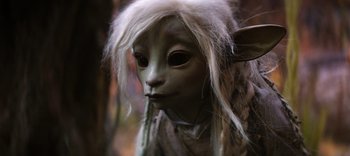 Movie still from “The Dark Crystal: Age of Resistance” (2019), created by Jim Henson – The face of an elf creature; Close Up shot, High angle
