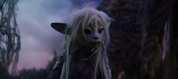 Movie still from “The Dark Crystal: Age of Resistance” (2019), created by Jim Henson – A person's face in a costume; Close Up shot, High angle