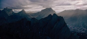 Movie still from “The Dark Crystal: Age of Resistance” (2019), created by Jim Henson – A view of a mountain range from a distance; Extreme Wide shot, High angle