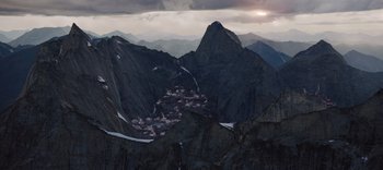 Movie still from “The Dark Crystal: Age of Resistance” (2019), created by Jim Henson – A view of a small town from the top of a mountain; Extreme Wide shot, High angle