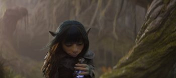 Movie still from “The Dark Crystal: Age of Resistance” (2019), created by Jim Henson – A woman in a forest holding a cell phone; Close Up shot, High angle