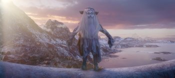 Movie still from “The Dark Crystal: Age of Resistance” (2019), created by Jim Henson – An image of a troll standing on top of a hill; Wide shot, Low angle