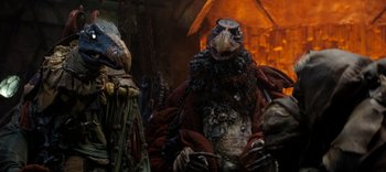 Movie still from “The Dark Crystal: Age of Resistance” (2019), created by Jim Henson – A group of people dressed up in costumes; Close Up shot, Low angle