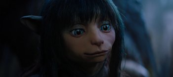 Movie still from “The Dark Crystal: Age of Resistance” (2019), created by Jim Henson – The face of a doll with blue eyes; Close Up shot, High angle