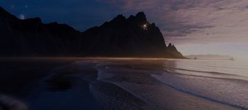 Movie still from “The Dark Crystal: Age of Resistance” (2019), created by Jim Henson – A view of a beach and mountains at night; Extreme Wide shot, High angle