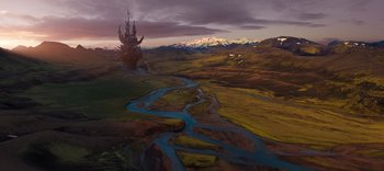 Movie still from “The Dark Crystal: Age of Resistance” (2019), created by Jim Henson – An aerial view of a river and a castle; Extreme Wide shot, High angle