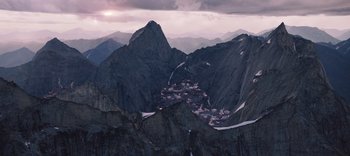 Movie still from “The Dark Crystal: Age of Resistance” (2019), created by Jim Henson – A view of a small town from the top of a mountain; Extreme Wide shot, High angle
