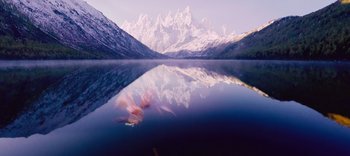 Movie still from “The Dark Crystal: Age of Resistance” (2019), created by Jim Henson – A body of water that has mountains in the background; Extreme Wide shot, High angle
