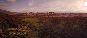 Movie still from “The Dark Crystal: Age of Resistance” (2019), created by Jim Henson – An aerial view of a valley with trees in the foreground; Extreme Wide shot, High angle