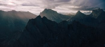 Movie still from “The Dark Crystal: Age of Resistance” (2019), created by Jim Henson – A view of a mountain range from a distance; Extreme Wide shot, High angle