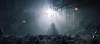 Movie still from “The Dark Crystal: Age of Resistance” (2019), created by Jim Henson – A person in a forest with lights shining on them; Wide shot, Low angle