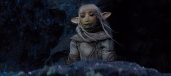 Movie still from “The Dark Crystal: Age of Resistance” (2019), created by Jim Henson – An image of an elf with long white hair; Close Up shot, High angle