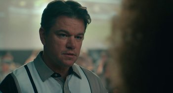 Movie still from “Air” (2023), directed by Ben Affleck – A person wearing a dress shirt; Close Up shot, Over the shoulder angle