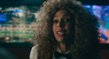 Movie still from “Air” (2023), directed by Ben Affleck – A person wearing a bow tie; Close Up shot, Over the shoulder angle