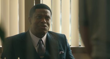 Movie still from “Air” (2023), directed by Ben Affleck – A man in a suit and a tie; Close Up shot, Over the shoulder angle