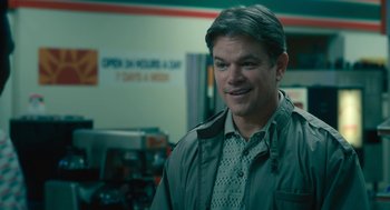 Movie still from “Air” (2023), directed by Ben Affleck – A person wearing a jacket in a room; Close Up shot, Over the shoulder angle