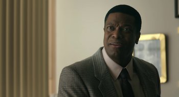 Movie still from “Air” (2023), directed by Ben Affleck – A person wearing a suit and tie; Close Up shot, Over the shoulder angle
