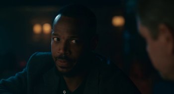 Movie still from “Air” (2023), directed by Ben Affleck – A person sitting in a room; Close Up shot, Over the shoulder angle