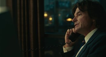 Movie still from “Air” (2023), directed by Ben Affleck – A man talking on a phone while sitting in a room; Close Up shot, Over the shoulder angle