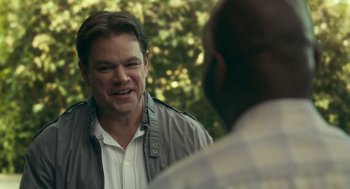 Movie still from “Air” (2023), directed by Ben Affleck – A man talking to another man in front of a tree; Close Up shot, Over the shoulder angle