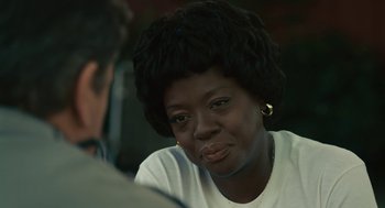 Movie still from “Air” (2023), directed by Ben Affleck – A black woman with short black hair sitting in front of another black man; Close Up shot, Over the shoulder angle