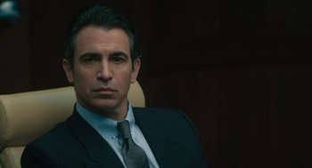 Movie still from “Air” (2023), directed by Ben Affleck – A person wearing a suit and tie; Close Up shot, Over the shoulder angle