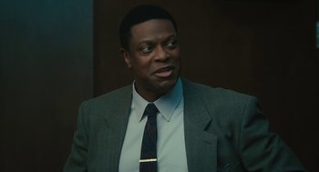 Movie still from “Air” (2023), directed by Ben Affleck – A man in a suit and a tie; Close Up shot, Low angle