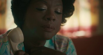 Movie still from “Air” (2023), directed by Ben Affleck – A person with her eyes closed; Close Up shot, High angle