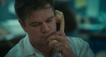 Movie still from “Air” (2023), directed by Ben Affleck – A person talking on a phone; Close Up shot, Low angle