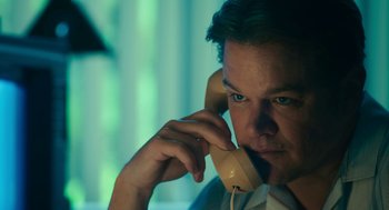 Movie still from “Air” (2023), directed by Ben Affleck – A person talking on a phone; Close Up shot, Low angle