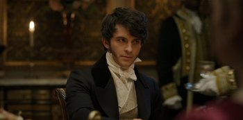 Movie still from “Bridgerton” (2020), created by Chris Van Dusen – A man in a suit and tie sitting in a chair; Close Up shot, Over the shoulder angle