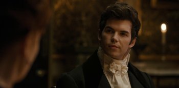 Movie still from “Bridgerton” (2020), created by Chris Van Dusen – A young man in a suit and white shirt; Close Up shot, Over the shoulder angle