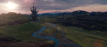 Movie still from “The Dark Crystal: Age of Resistance” (2019), created by Jim Henson – An aerial view of a river with a castle in the middle of it; Extreme Wide shot, High angle