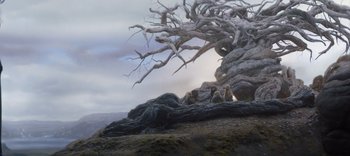 Movie still from “The Dark Crystal: Age of Resistance” (2019), created by Jim Henson – An old tree is sitting on the ground; Wide shot, Low angle